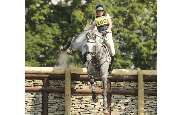 flora-harris-has-a-scarry-moment-while-jumping-a-big-wall-in-the-Inermediat-champs-gatcombe-park-8-8-15